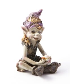 Pesky Cornish Pisky sitting contentedly. The figure has a cheerful expression and is dressed in a playful outfit, complemented by a colorful, pointed hat.