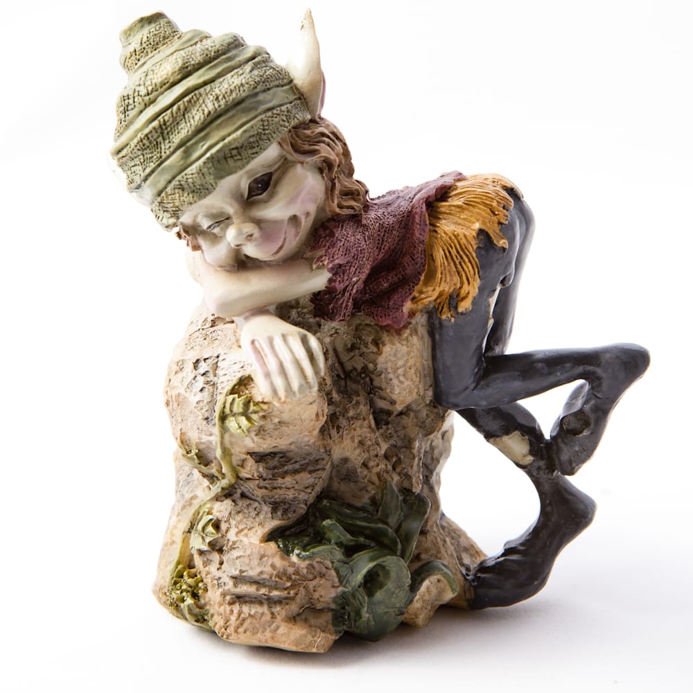 Cornish pesky pisky playfully perched on a tree stump. The pisky has a mischievous expression, wearing a colorful outfit and a distinctive green hat.