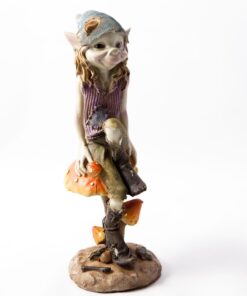 Cornish pesky piskie sitting confidently on a large mushroom. The pisky has a playful expression and is dressed in colorful, patched clothing, complete with a whimsical hat
