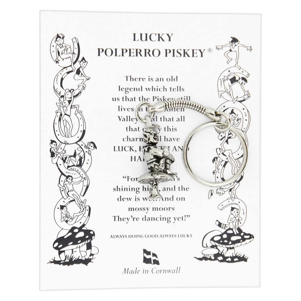 A pewter lucky Cornish Pisky keyring seated on a mushroom. The piskie is, adorned with a pointed hat, has a playful expression