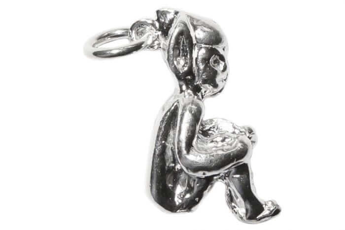 Sterling silver delightful Cornish Piskie charm in a seated position.