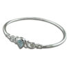 925 sterling silver bracelet features a delicate design with a teardrop-shaped blue topaz gemstone set in a silver band