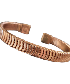 Magnetic copper therapy bracelet in an open cuff design, featuring a distinctive ridged and grooved diagonal pattern, crafted from solid copper with magnets embedded at each end for potential arthritis relief, improved circulation, and overall wellness benefits.
