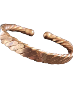 Magnetic copper therapy bracelet in an open cuff design, featuring a sleek, flattened twisted rope pattern crafted from solid copper, with rounded ends housing magnets for potential arthritis relief, improved blood circulation, and overall wellness support.