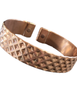 Solid copper magnetic bracelet in an open cuff design, featuring a textured diamond-pattern surface and magnets embedded at each end for potential wellness benefits.