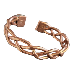 Handmade copper magnetic bracelet featuring an intricate twisted braid design, open cuff style, with magnets set into each end for potential therapeutic benefits.