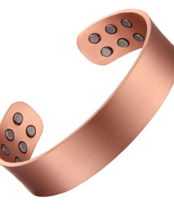 A wide copper open cuff bangle with a smooth, brushed matte finish for a clean and minimalist look. The interior features multiple round inset magnets—three on each end—designed to combine simple elegance with potential magnetic therapy benefits.