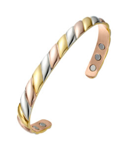 A copper open cuff bangle featuring a twisted rope-style design with alternating segments of rose gold-toned copper, golden brass, and silvery nickel. The interior is smooth and fitted with multiple round inset magnets near each end, combining a colourful tri-metal look with potential magnetic therapy benefits.