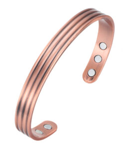 A copper open cuff bangle featuring a triple-groove design along its length, giving it a sleek and textured appearance. The inside surface is smooth and fitted with multiple round inset magnets near each end, combining stylish detailing with potential magnetic therapy benefits.