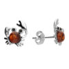 Sterling silver crab-shaped stud earrings with round amber gemstone centers.