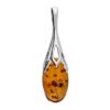 Sterling silver pendant with oval cognac Baltic amber in an elegant openwork silver setting