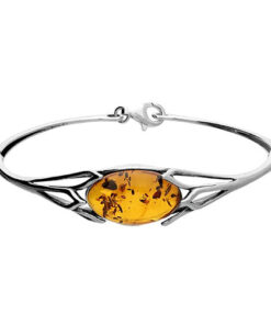 925 sterling silver bangle bracelet featuring an oval amber gemstone with natural inclusions set in an elegant openwork design.