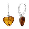 Heart-shaped amber drop earrings with sterling silver lever-back clasps.