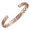 An intricate tri-tone twisted braided bio magnetic copper cuff bracelet displaying an interwoven herringbone design of rose gold, yellow gold, and silver metallic strands, with three circular therapeutic magnets embedded on the inner surface of each open end against a white background.