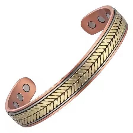 A tri-tone bio magnetic pure copper cuff bracelet featuring a detailed, embossed gold-toned chevron wheat pattern central track bordered by thin silver-toned stripes on a polished copper base, with three circular therapeutic magnets visible on the inner surface of each open end against a white background.