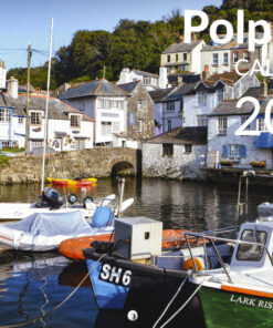 A harbor scene in Polperro, Cornwall, featuring small boats moored in calm water in the foreground, including a green and white boat labeled "LARK RISE". Whitewashed stone cottages with slate roofs line the harbor and rise up a green hillside under a blue sky. Polperro 2027 calendar