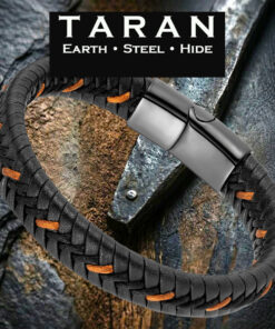 Taran braided black leather bracelet with tan stitching and a sleek gunmetal steel magnetic clasp, set against a rugged stone and wood background.