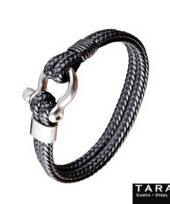 A Taran men's bracelet featuring a multi-strand black braided leather band and a polished silver steel shackle clasp, isolated on a clean white background. Includes the 'TARAN Earth Steel Hide' brand logo in the bottom right corner.