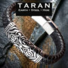 Taran black braided leather bracelet with an engraved silver filigree plate and a sleek stainless steel magnetic clasp, isolated on a plain white background.