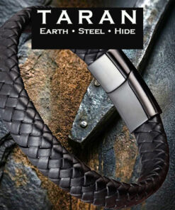 A Taran men's wide braided leather bracelet featuring a thick, flat-plait woven pattern made from premium genuine black hide. Includes an integrated, rectangular matte black stainless steel magnetic clasp.