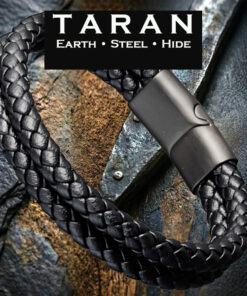 A Taran men's black leather double-strand bracelet showing two identical parallel woven cords attached to an industrial matte-black stainless steel magnetic slide clasp. The double strands are made of high-density, tightly braided genuine black leather with a rounded tactile plait pattern.