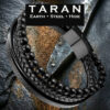 A Taran men's black leather and bead multi-strand bracelet featuring a pre-stacked tri-texture layout. The design includes a row of matte black onyx-style beads, a central cord of tightly woven black braided leather, and a flat grain-textured leather band. The strands are secured by a geometric, two-tone brushed gunmetal and matte black magnetic stainless steel clasp,