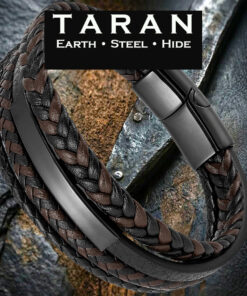 A Taran men's black and brown leather bracelet featuring a pre-stacked multi-strand layout. The design displays two rows of interwoven, alternating espresso brown and black braided leather, a solid black lower accent strand, and a curved, matte black stainless steel ID bar. The strands are secured by a geometric matte black magnetic slide clasp.