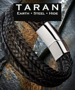 A Taran men's black braided leather multi-strand bracelet featuring a heavy triple-strand layout. Three thick rows of tightly woven black leather hide run parallel to each other, creating a dense, tactile herringbone texture. The strands connect into a large, curved, mirror-polished silver stainless steel magnetic slide clasp.